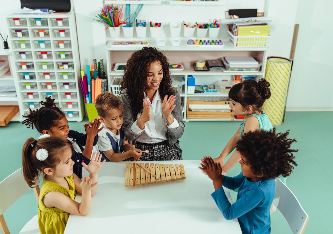 librarian with children at table